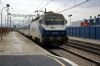 An Arco train passes Alzira station in 2006