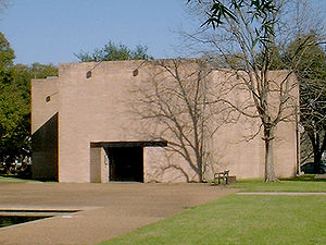 Plain, unadorned granite structure, with minimal features. Only an entrance is visible.