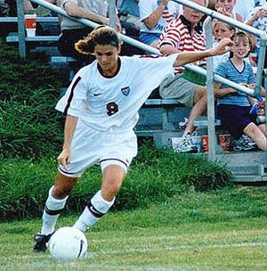 Mia Hamm takes corner kick.