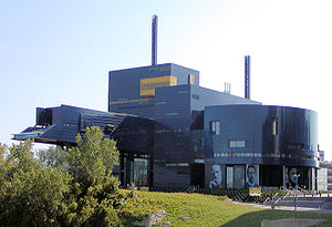 view from the Mississippi river side showing the Guthrie's design and bridge to nowhere and green foliage