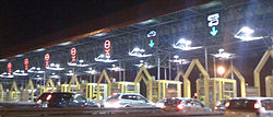 Toll plaza booths with variable traffic signs placed over the toll gates.