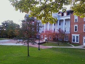 Picture of a four story building with white columns