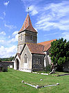 Stone church with red tiled roofs.