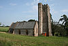 Stone building with sqauer tower.