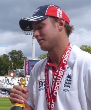 A side shoot of a white-skinned man holding a trophy in his hand