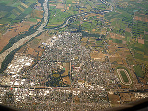 Aerial view of Ashburton, looking west. The Ashburton River or Hakatere is visible at left.