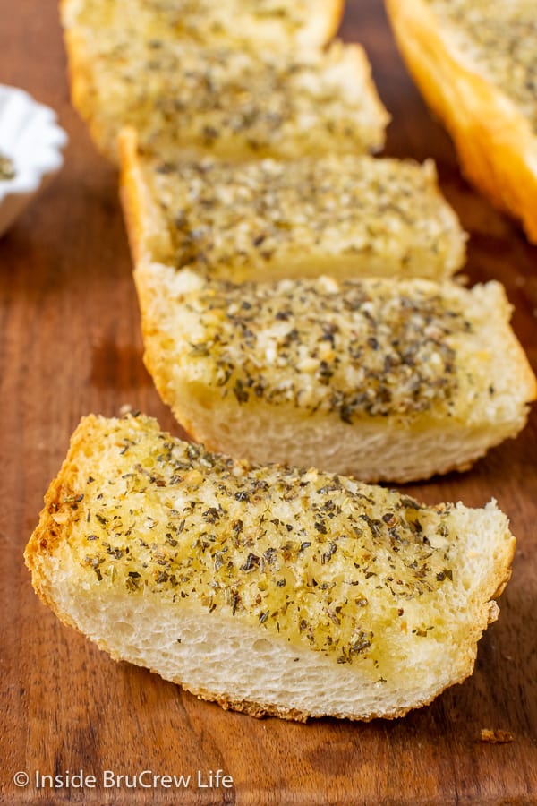 Easy Garlic Herb Bread - spread garlic herb butter all over the inside of a French bread loaf and bake until toasted. Make this easy recipe to enjoy with any dinner.