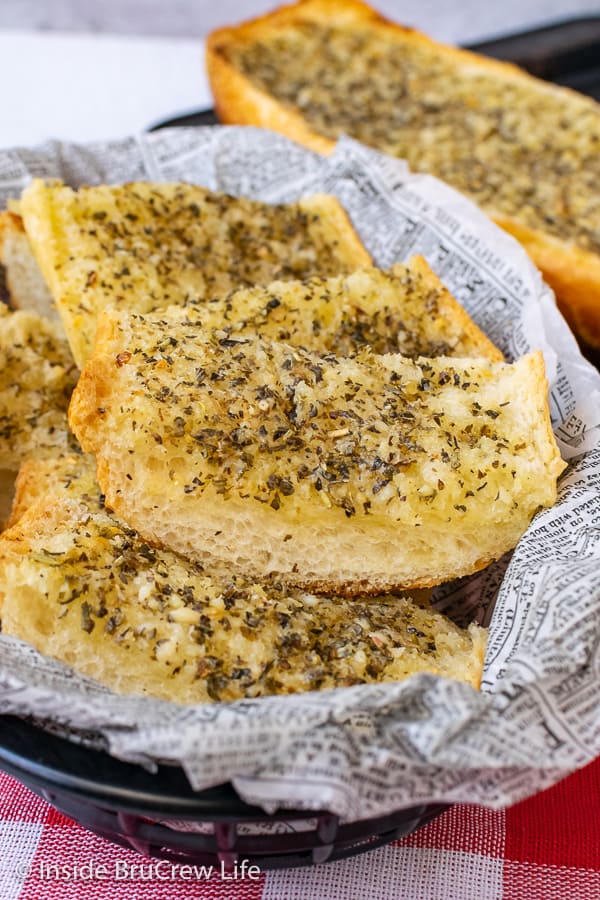 Easy Garlic Herb Bread - make your own garlic herb butter and spread it all over a loaf of French bread right before dinner. This easy and delicious recipe goes with everything.