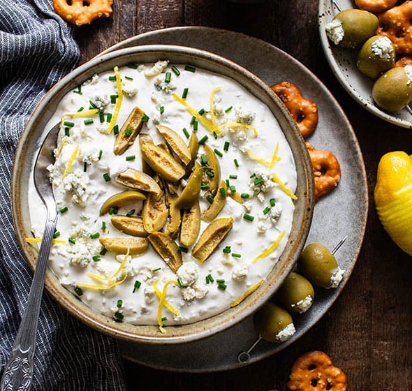 sour cream and cream cheese olive dip in a bowl