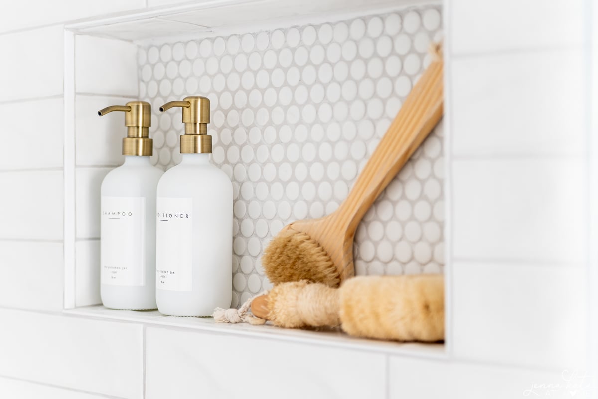 shampoo niche in a shower with pretty bottles