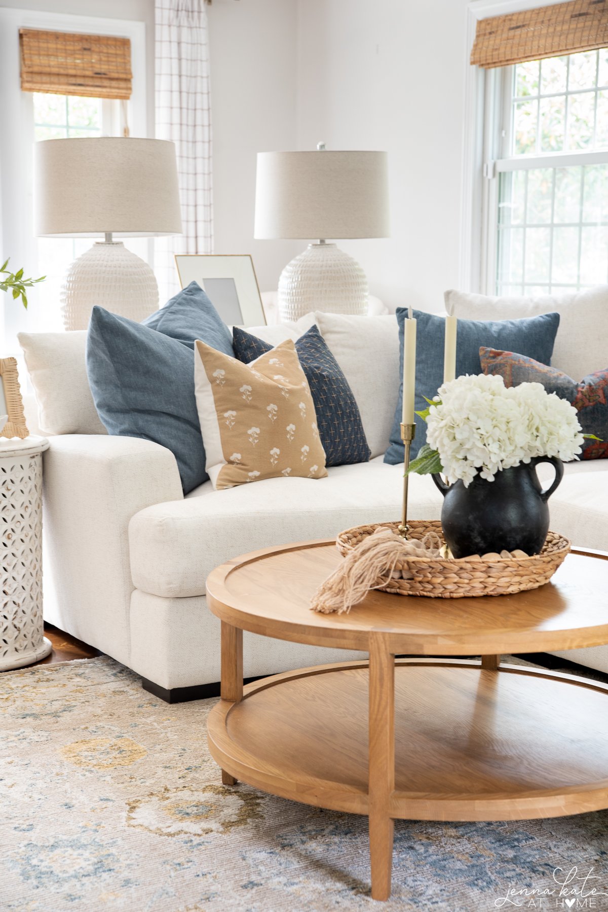 styled coffee table and white sectional couch