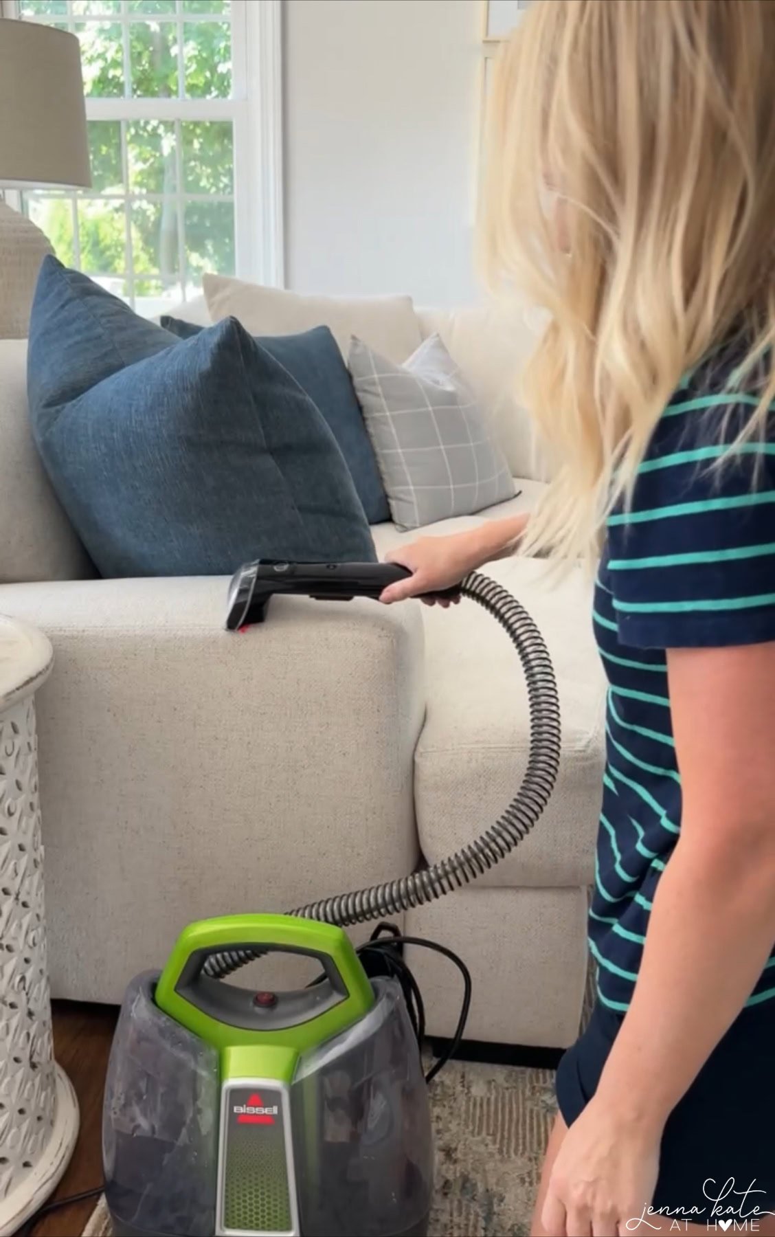 woman cleaning a couch