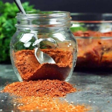 small glass jar of blackening seasoning