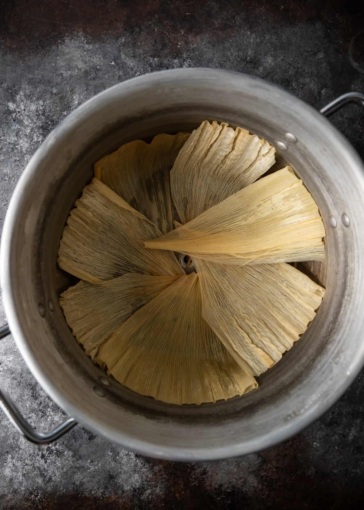 overhead: loading the tamales rojo to steam