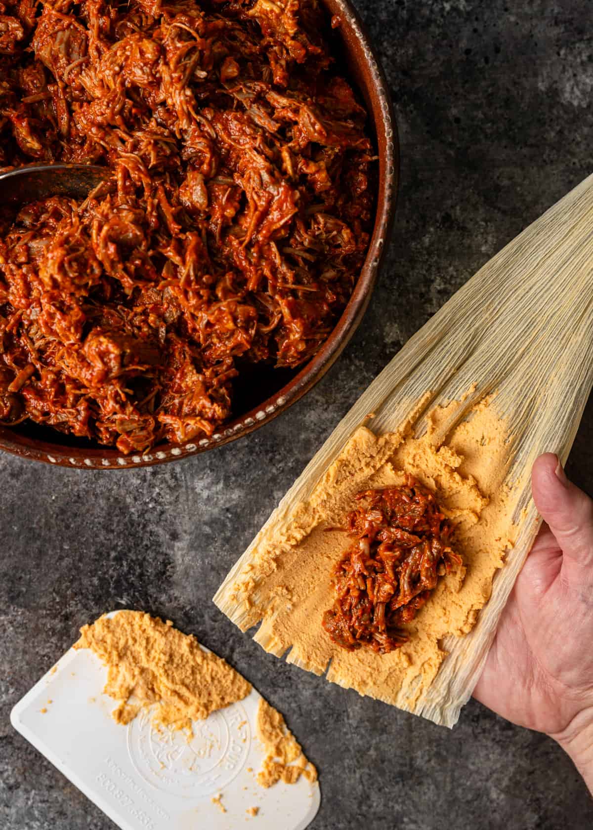 overhead: adding the filling on top of the masa