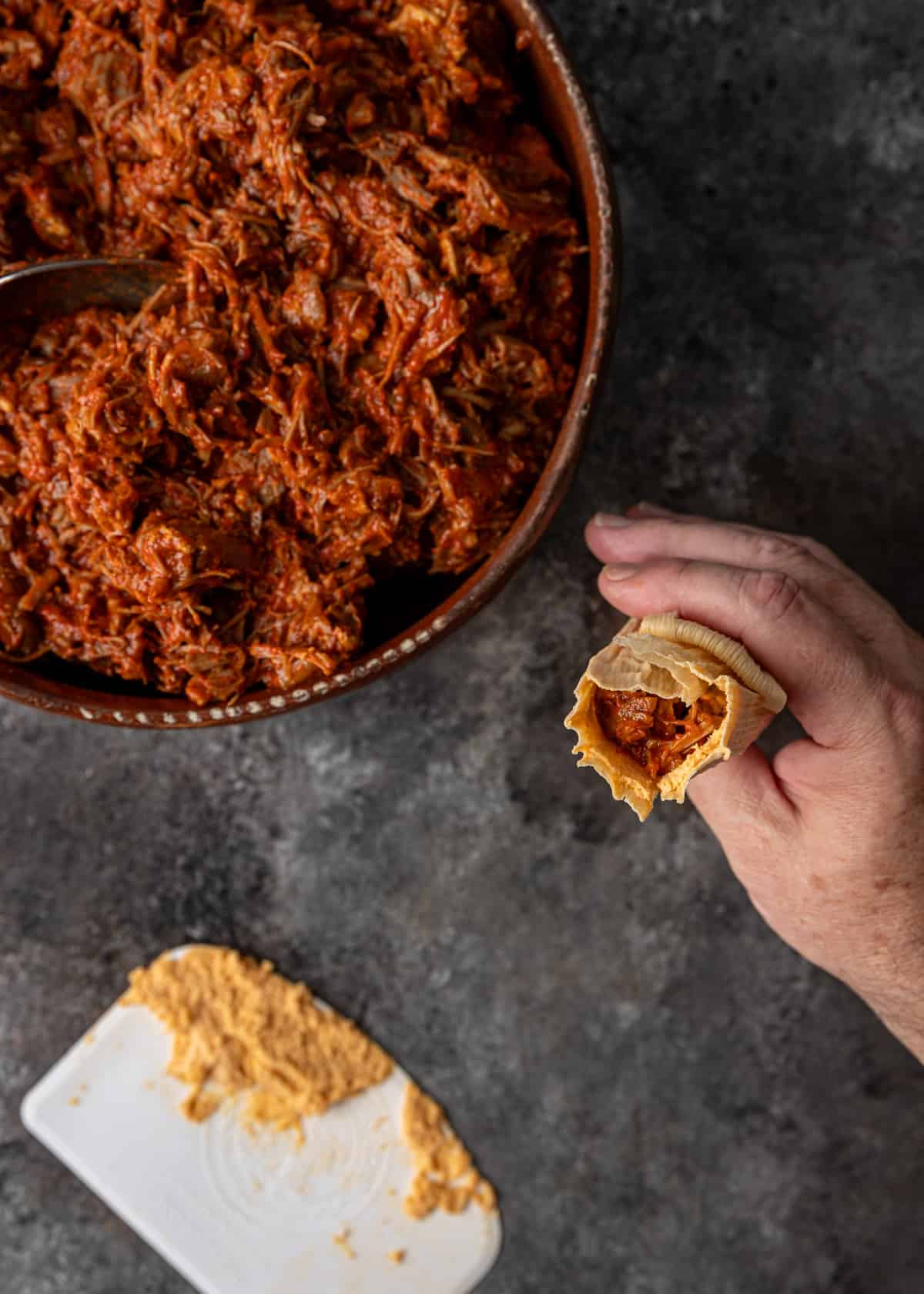 overhead: folding the tip to top to close tamale