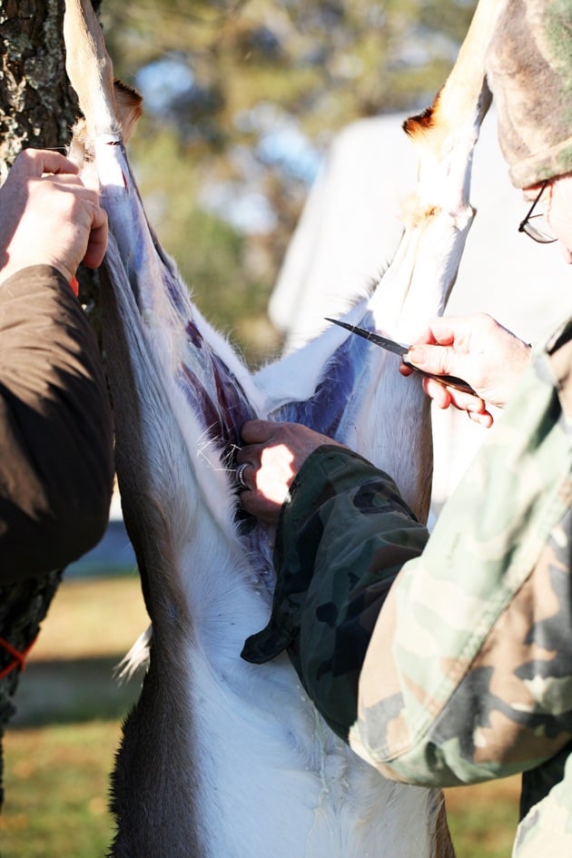 Cutting the skin around the joint. 