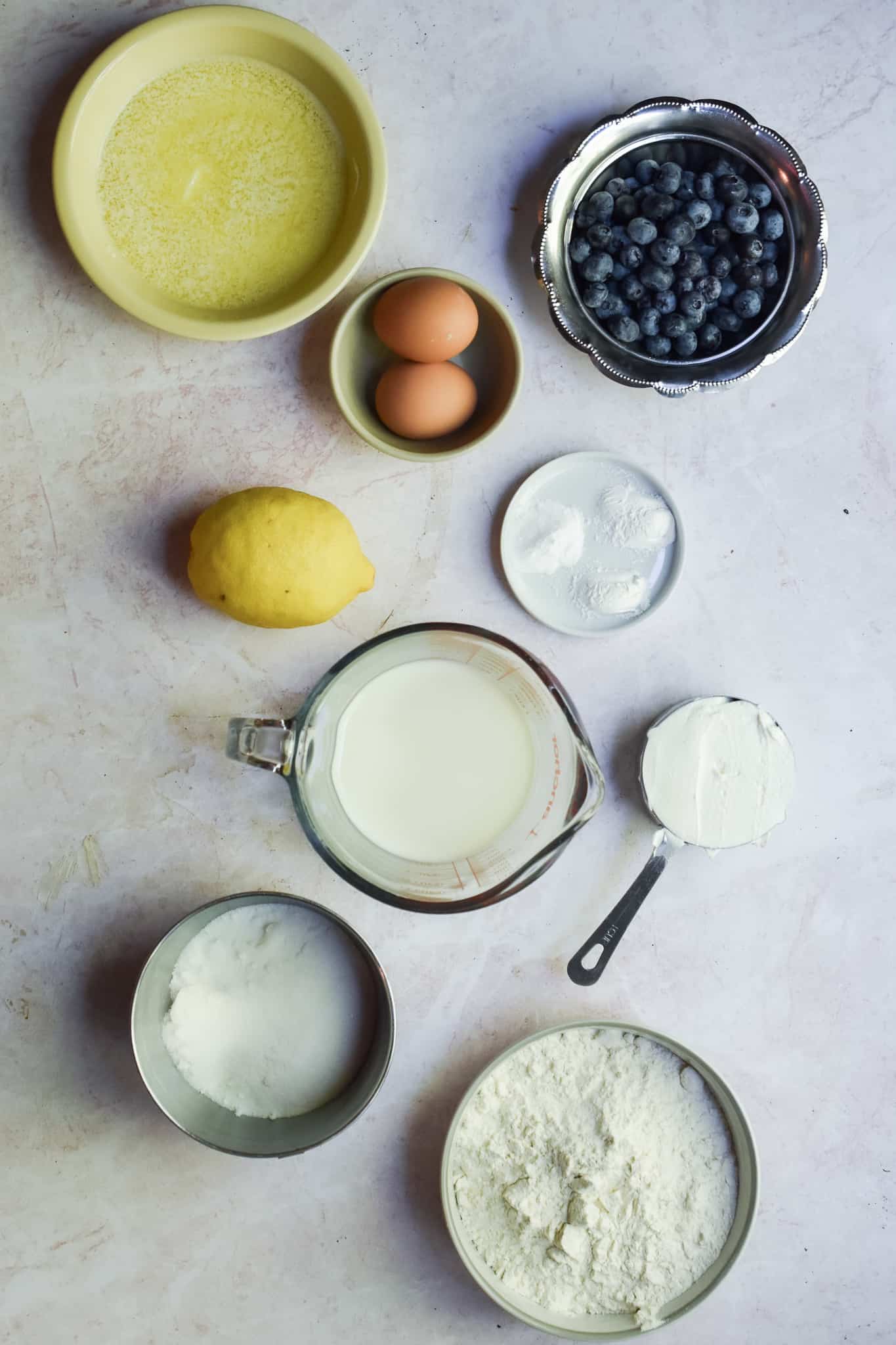 An overhead shot of the ingredients for blueberry muffins with sour cream