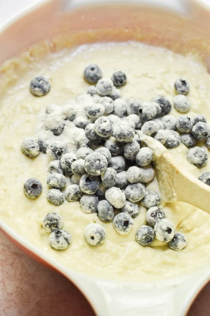 The blueberries are folded into the batter.