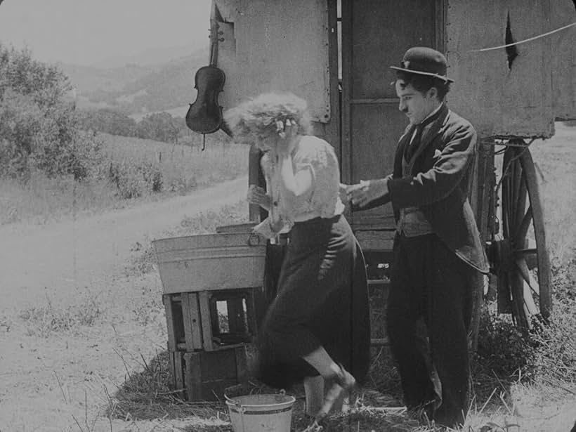 Charles Chaplin and Edna Purviance in The Vagabond (1916)