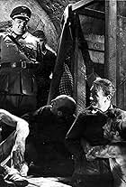 Lionel Jeffries, John Mills, and Denis Shaw in The Colditz Story (1955)