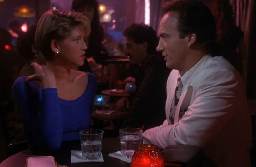 Jim Belushi and Loryn Locklin in Taking Care of Business (1990)