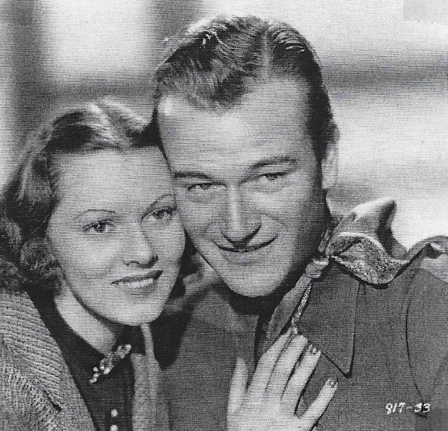 John Wayne and Lorna Gray in Red River Range (1938)