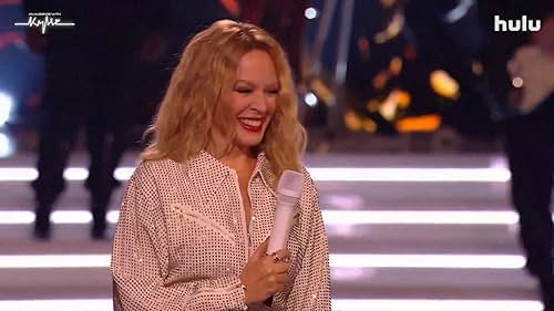 Pop icon Kylie Minogue takes center stage in her very own musical extravaganza. Joining her are some fellow pop stars, each performing in front of a celebrity audience.