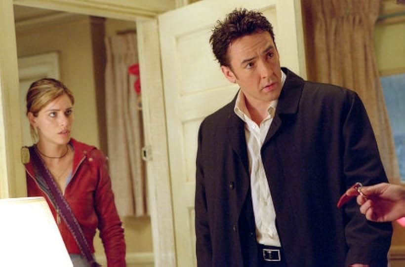 John Cusack and Amanda Peet in Identity (2003)