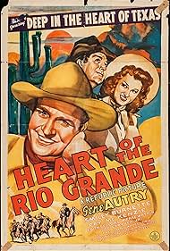 Gene Autry, Smiley Burnette, and Fay McKenzie in Heart of the Rio Grande (1942)