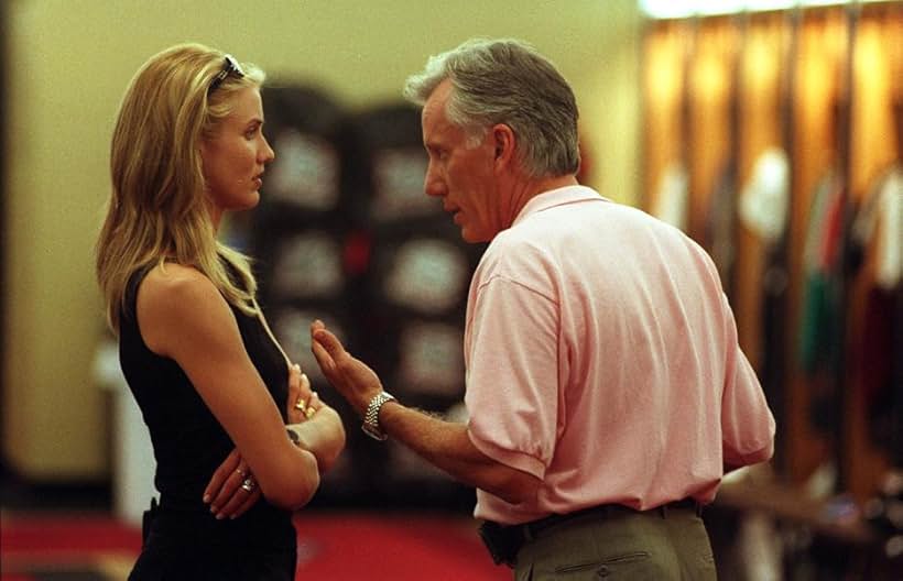 Christina and Harvey talk in the locker room