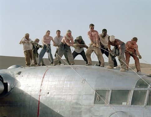 The survivors of a downed aircraft pull together to build a new plane out of the wreckage of the old one.  (L to R) Jacob Vargas, Giovanni Ribisi, Miranda Otto, Hugh Laurie, Scott Michael Campbell, Kevork Malikyan, Dennis Quaid, Tyrese Gibson, Kirk Jones and Tony Curran. 