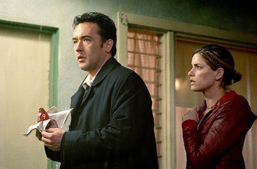 John Cusack and Amanda Peet in Identity (2003)