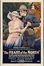 Louise Lovely and Roy Stewart in The Heart of the North (1921)