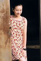 Jie Dong in Happy Times (2000)