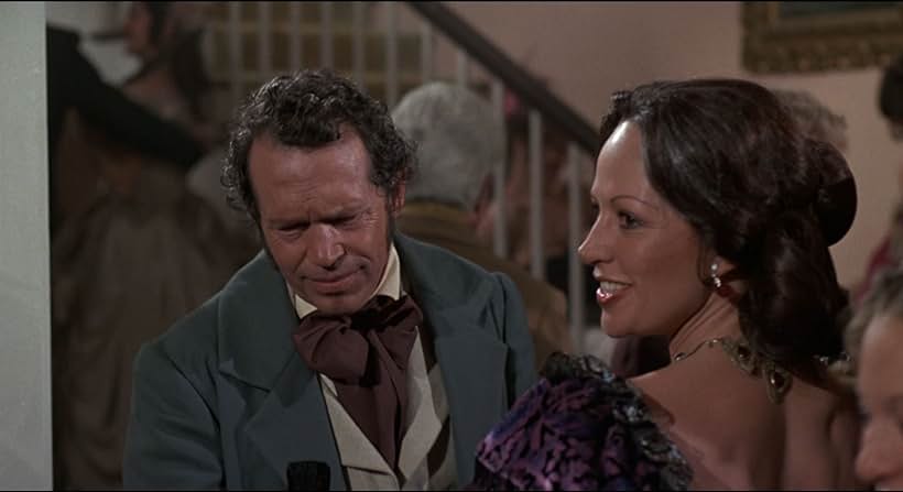 Warren Oates and Isela Vega in Drum (1976)