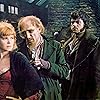 Oliver Reed, Ron Moody, and Shani Wallis in Oliver! (1968)