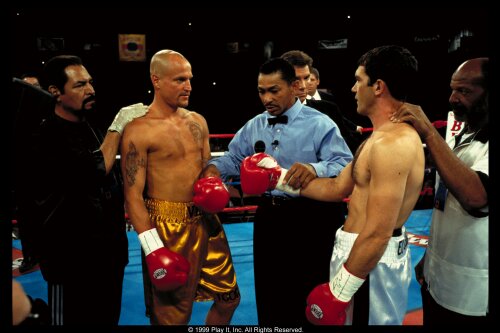 Vince and Cesar get instruction from the ref (Darrel Foster), flanked by their trainers, played by Eloy Casados (left) and Henry G. Sanders (right).  Famed ring announcer, Michael Buffer stands behind the ref. 