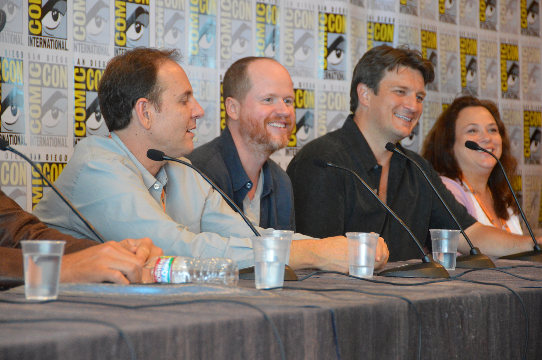 Nathan Fillion, Tim Minear, and Joss Whedon at an event for Firefly (2002)