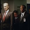 (Foreground, left to right) James Cromwell as President Fowler and Morgan Freeman as DCI William Cabot, (background, left to right) Philip Baker Hall as Defense Secretary Becker, Bruce McGill as National Security Advisor Revell and John Beasley as General Lasseter in   