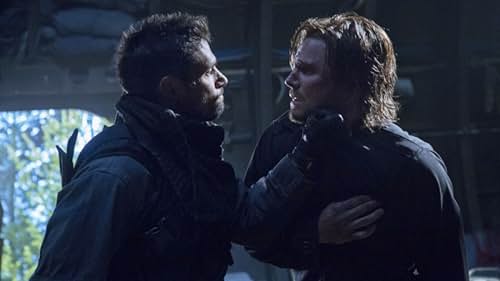 Manu Bennett and Stephen Amell in Arrow (2012)