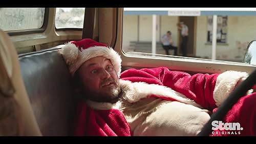 On an outback farm ravaged by drought, the lives of a struggling family are upended when a runaway criminal dressed as Santa Claus crashes onto their property.