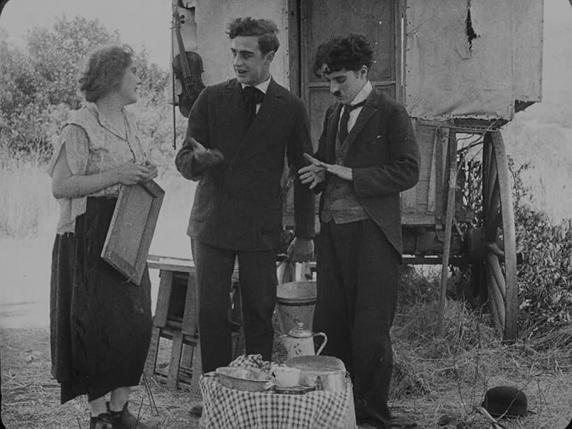 Charles Chaplin, Lloyd Bacon, and Edna Purviance in The Vagabond (1916)