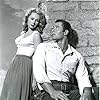 Virginia Mayo and Clint Walker in Fort Dobbs (1958)