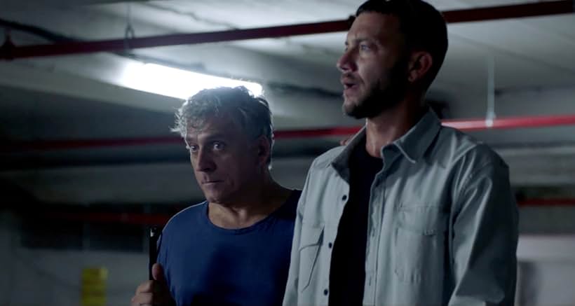 Lior Ashkenazi and Oz Zehavi in Traitor (2022)