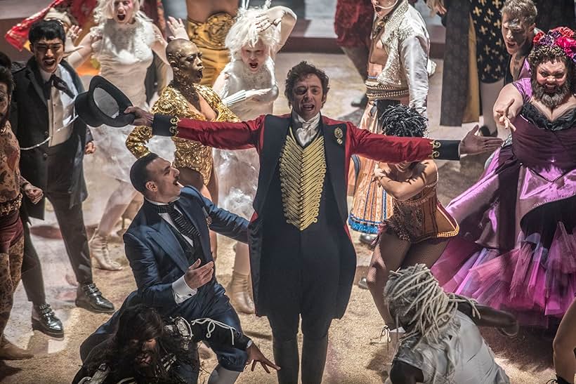 Kenneth Chan, Hugh Jackman, Sunny Walters, Martha Nichols, Caoife Coleman, Jeremy Hudson, Shannon Holtzapffel, Khasan Brailsford, Taylor James, Keala Settle, Jonathan Redavid, Luciano Acuna Jr., and Mishay Petronelli in The Greatest Showman (2017)