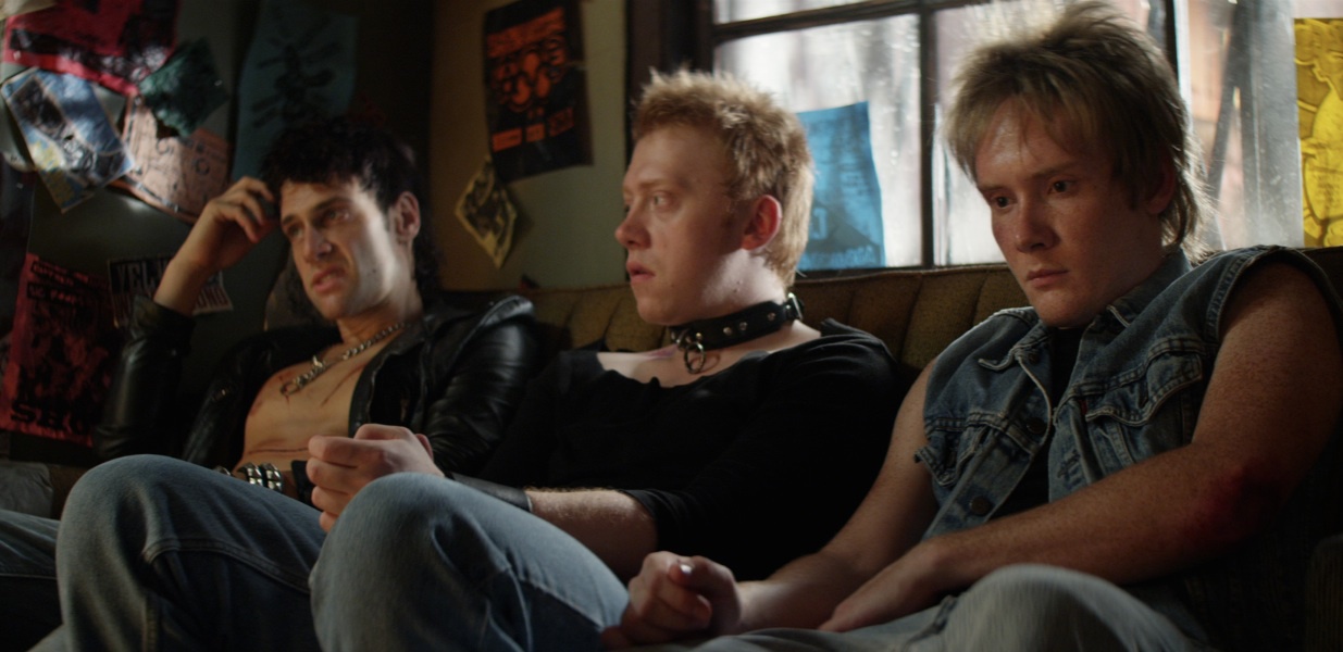 Justin Bartha, Rupert Grint, and Bronson Adams in CBGB (2013)