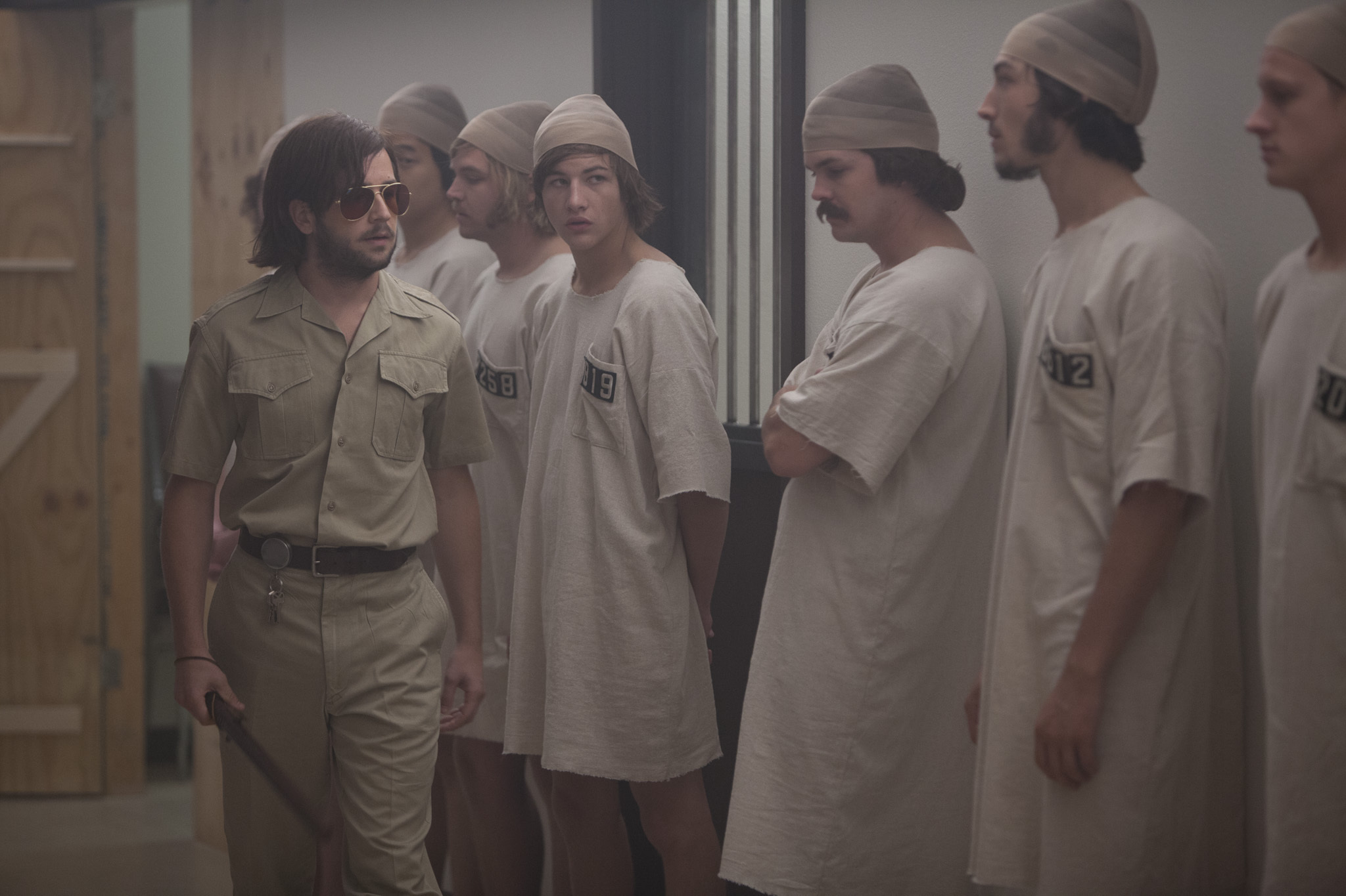 Michael Angarano, Chris Sheffield, Brett Davern, Johnny Simmons, Ezra Miller, Ki Hong Lee, and Tye Sheridan in The Stanford Prison Experiment (2015)