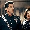 Sandra Bullock and Sylvester Stallone in Demolition Man (1993)