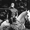 The Phantom (Billy Zane) roams thejungle on his dependable horse, Hero.